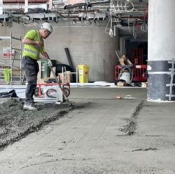 Our Laser-Guided Screed Robot smoothes our Rapidur® EB5 Rapid Dry Screed | B Doherty Mobile Factory